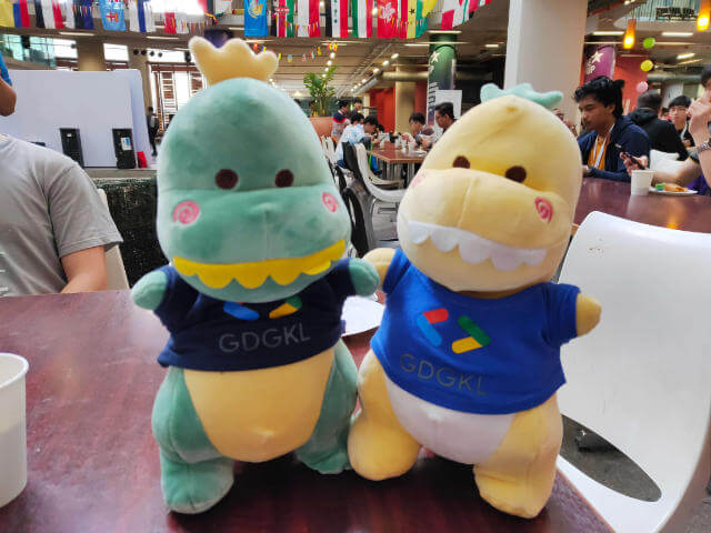 Green and yellow dinosaur plushie